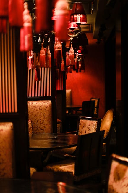 Elegant interior of PlayLounge RO casino with luxurious red and gold decor